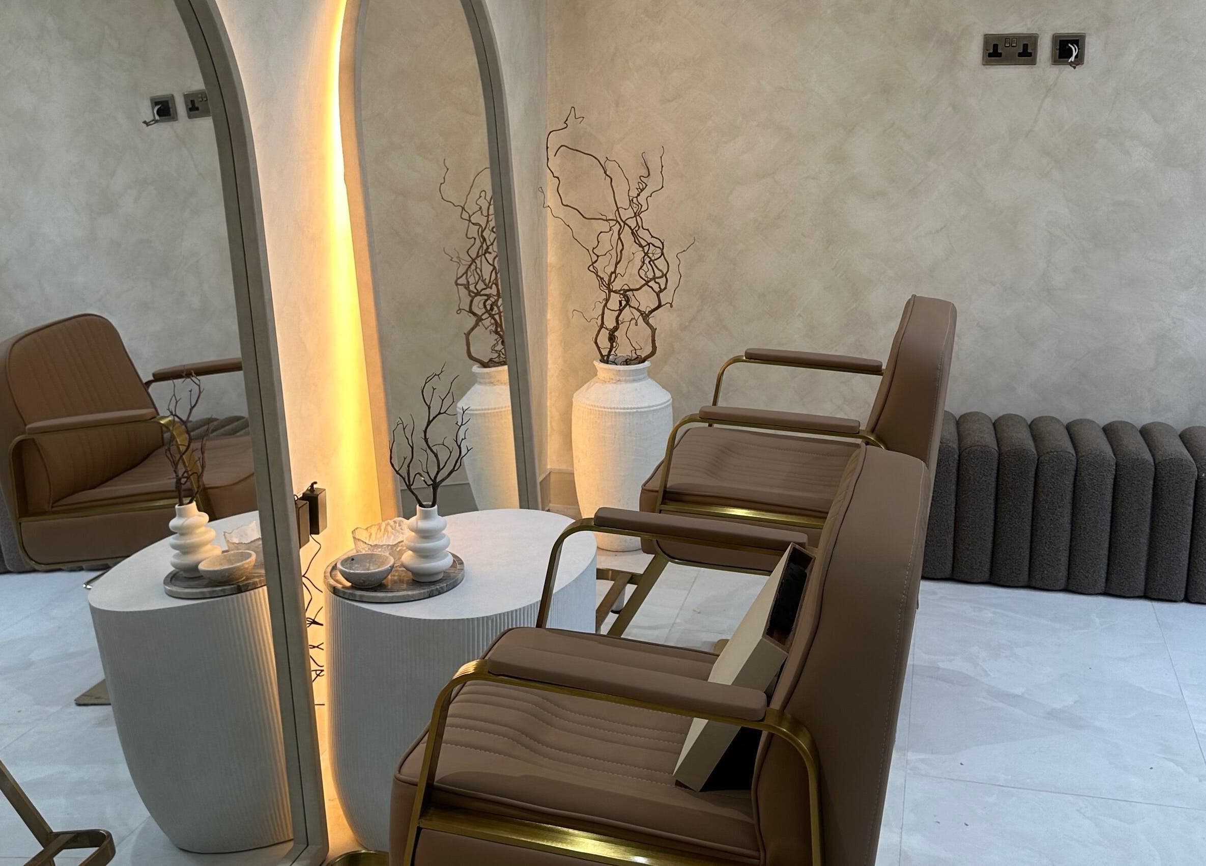 Elegant seating area at HBA HAIR, Leicester, England, GB, featuring stylish chairs and modern décor.