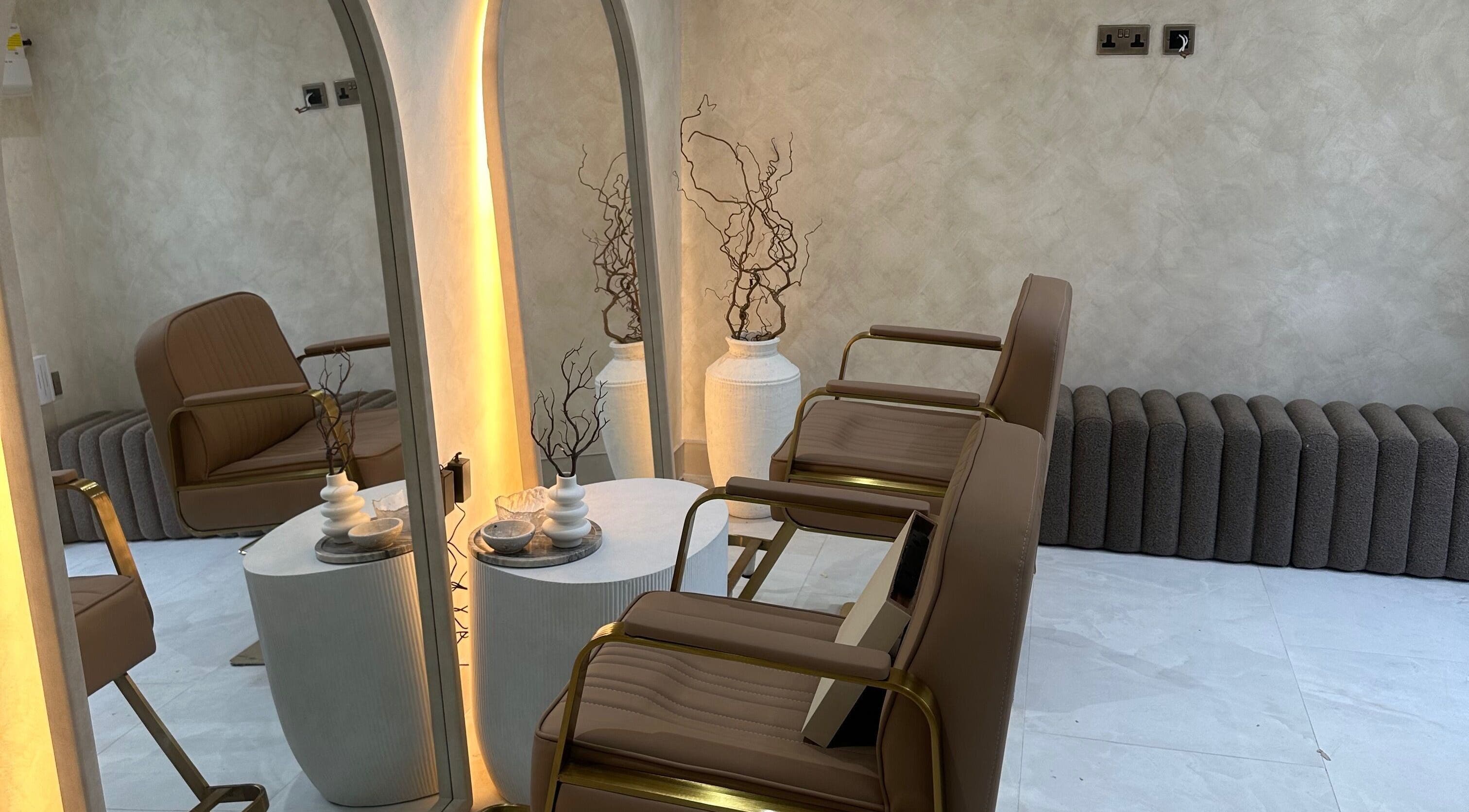 Elegant seating area at HBA HAIR, Leicester, England, GB, featuring stylish chairs and modern décor.