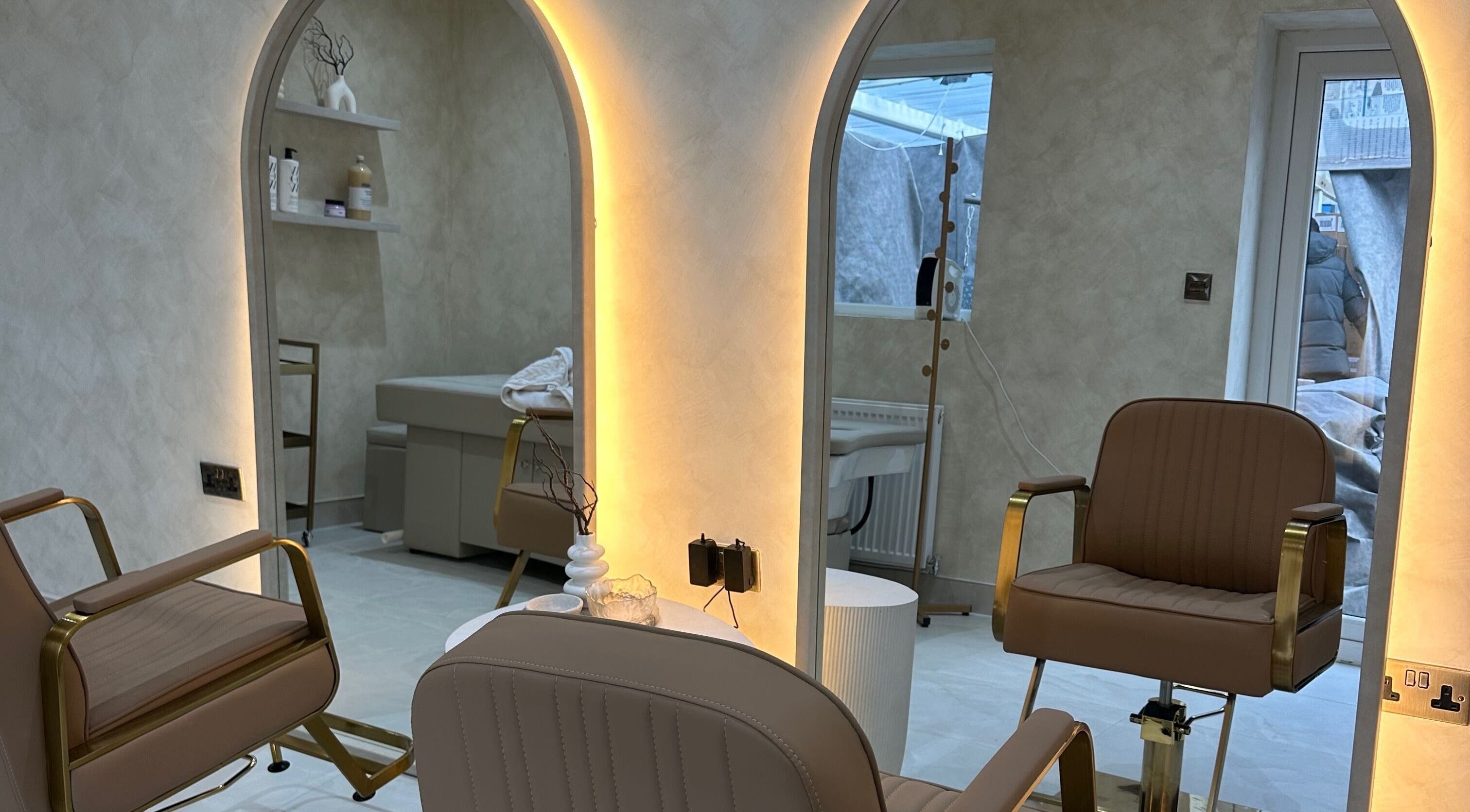 Luxurious salon interior at HBA HAIR, Leicester, England, GB with chic seating and modern decor.