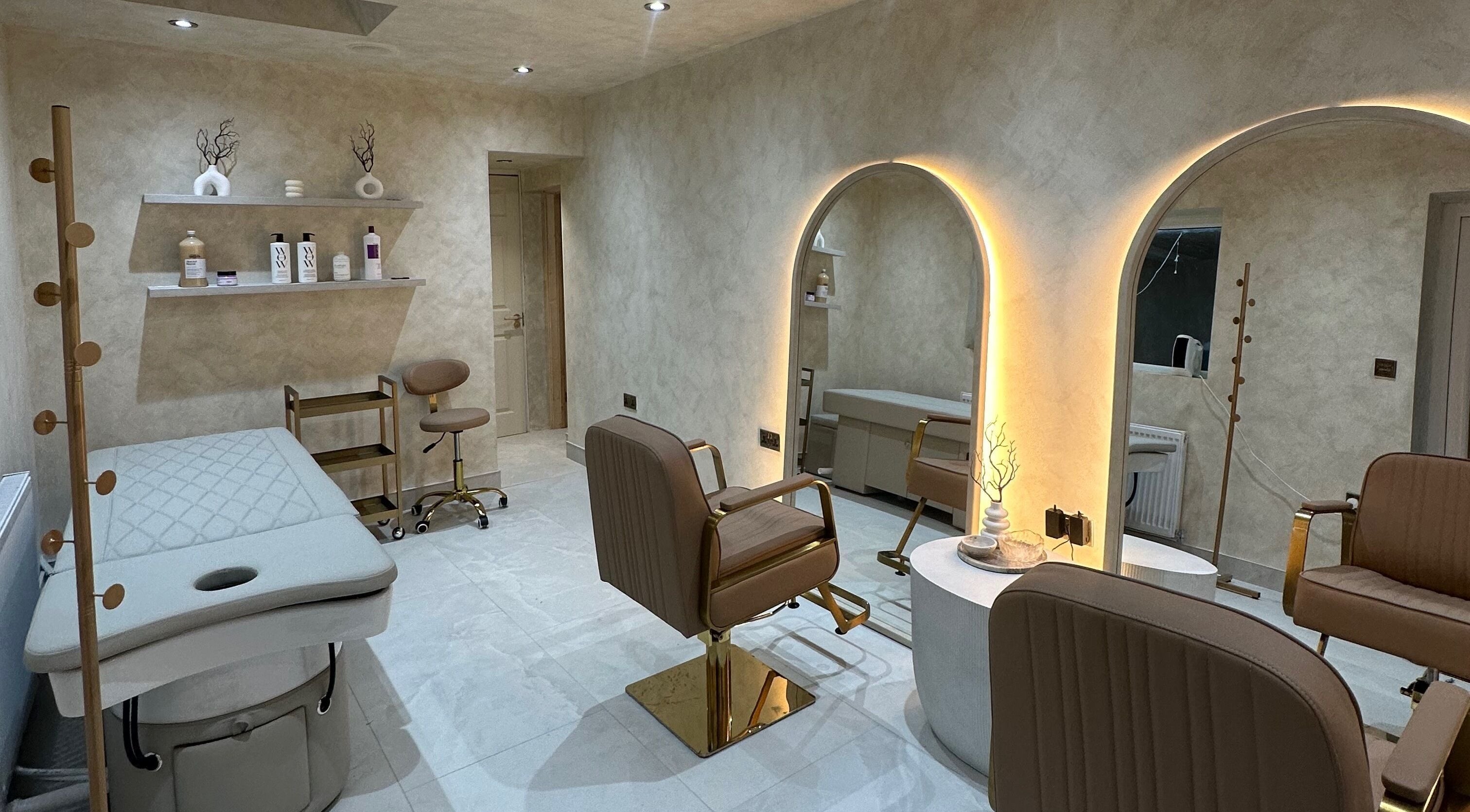 Elegant interior of HBA HAIR in Leicester, England, GB featuring plush chairs and modern decor.