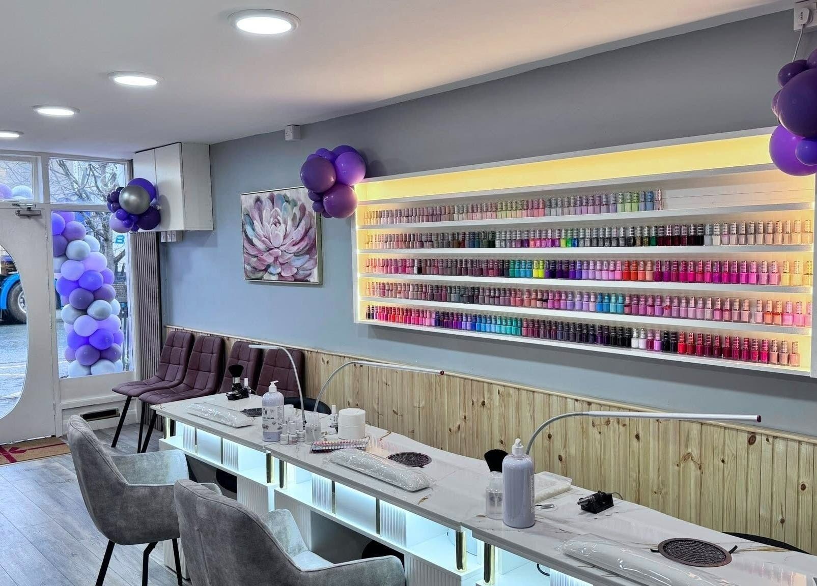 Rika Nails & Beauty in County Louth showcases a vibrant nail polish display with elegant decor.