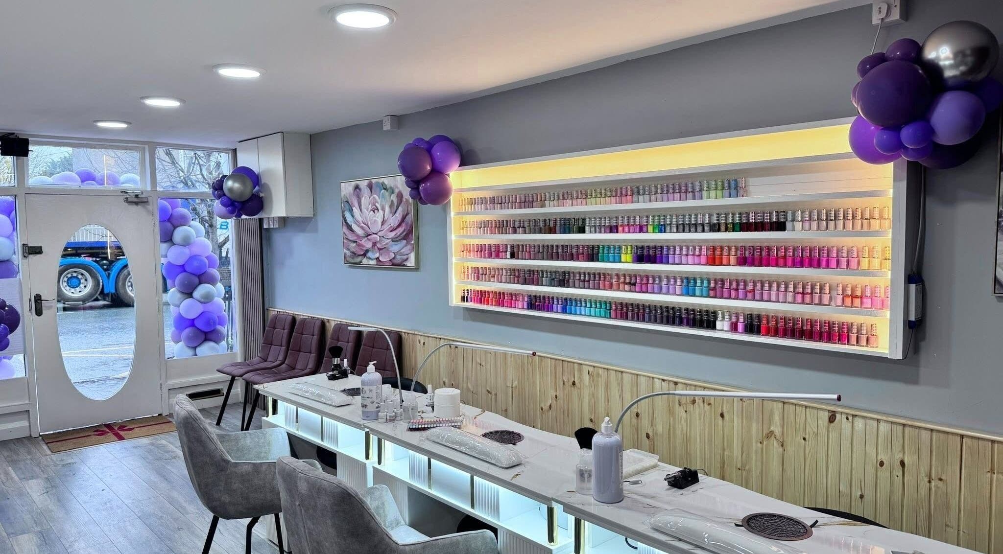 Rika Nails & Beauty in County Louth showcases a vibrant nail polish display with elegant decor.