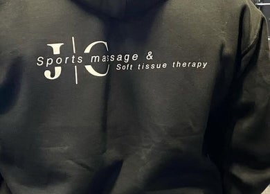 JC Sports Massage and Soft Tissue Therapy hoodie logo in Chesterfield, England, GB gym setting.