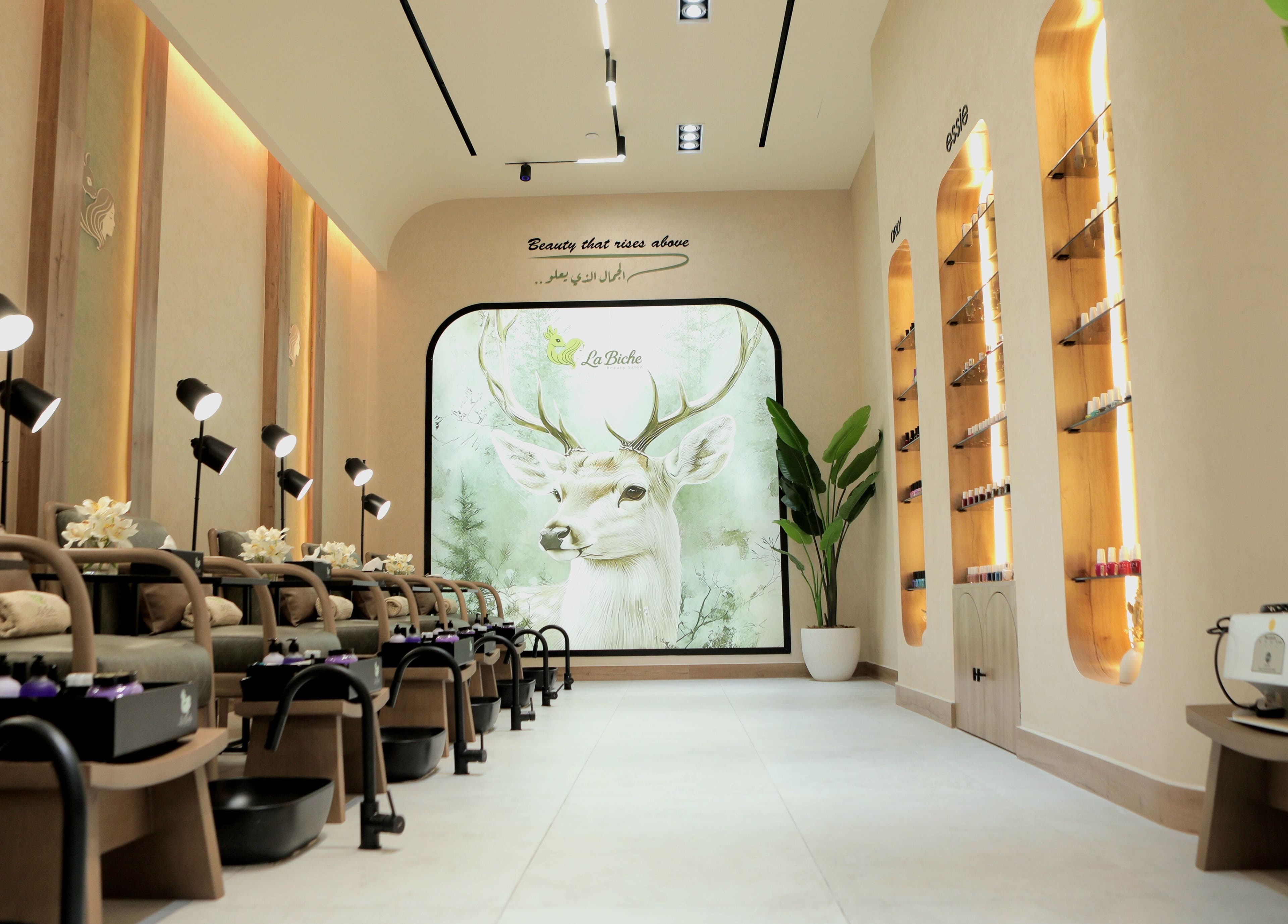 Elegant interior of La Biche Beauty Salon in Abu Dhabi, featuring serene decor and luxurious seating.