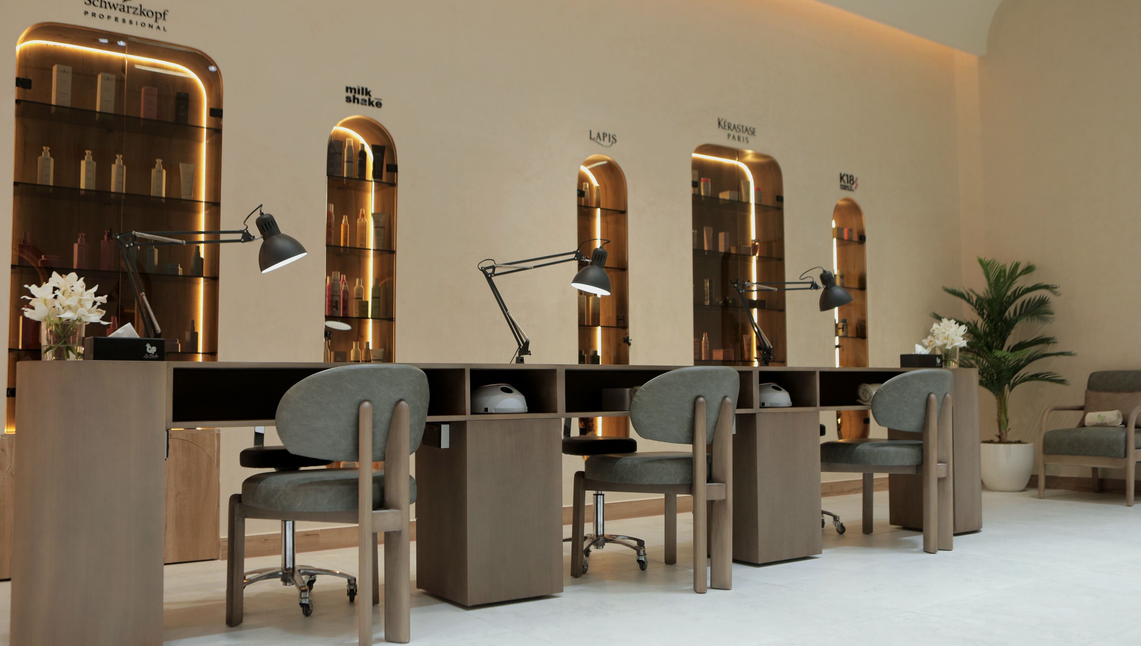 Chic manicure station at La Biche Beauty Salon, Abu Dhabi, Abu Dhabi, AE with stylish lighting and seating.