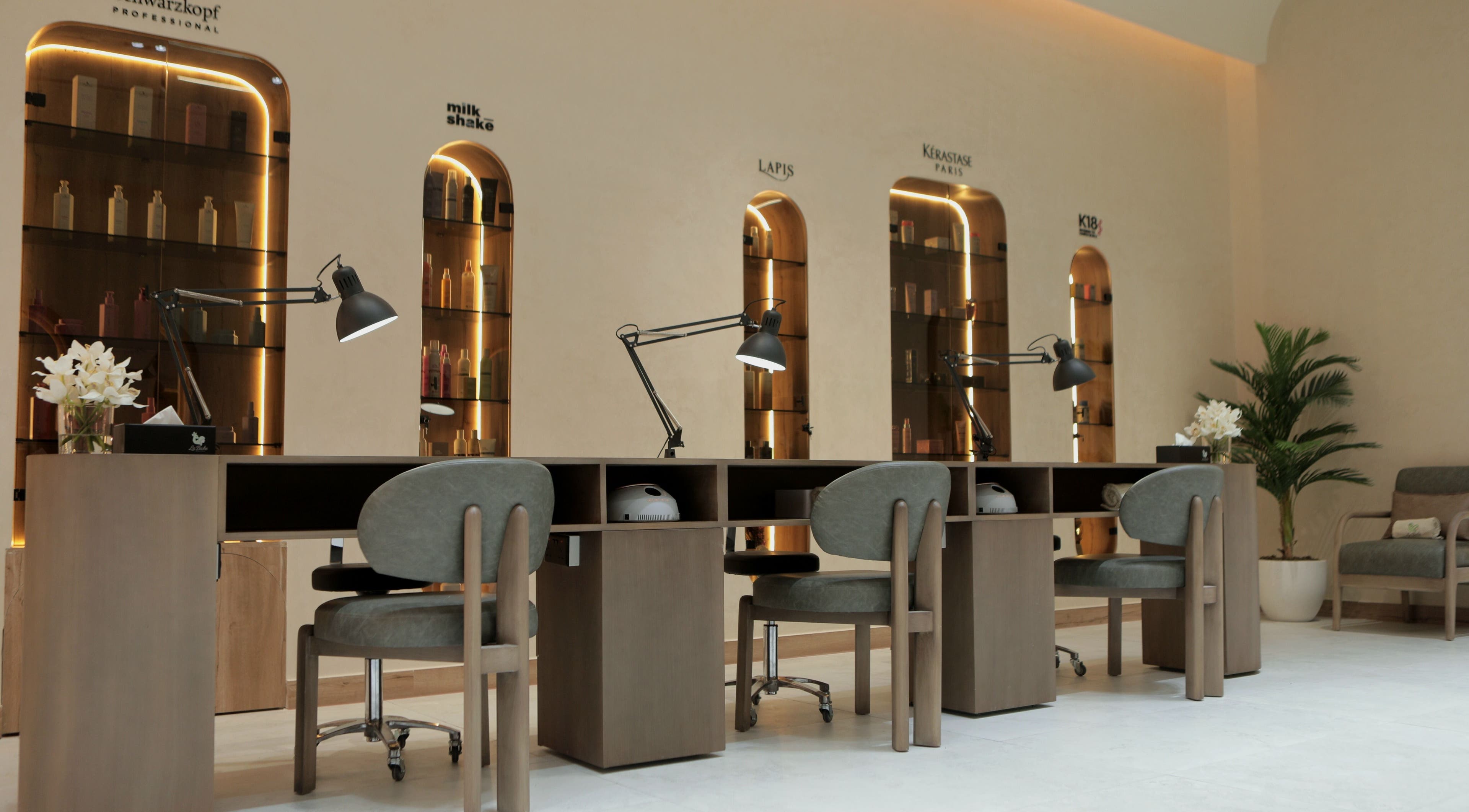 Chic manicure station at La Biche Beauty Salon, Abu Dhabi, Abu Dhabi, AE with stylish lighting and seating.