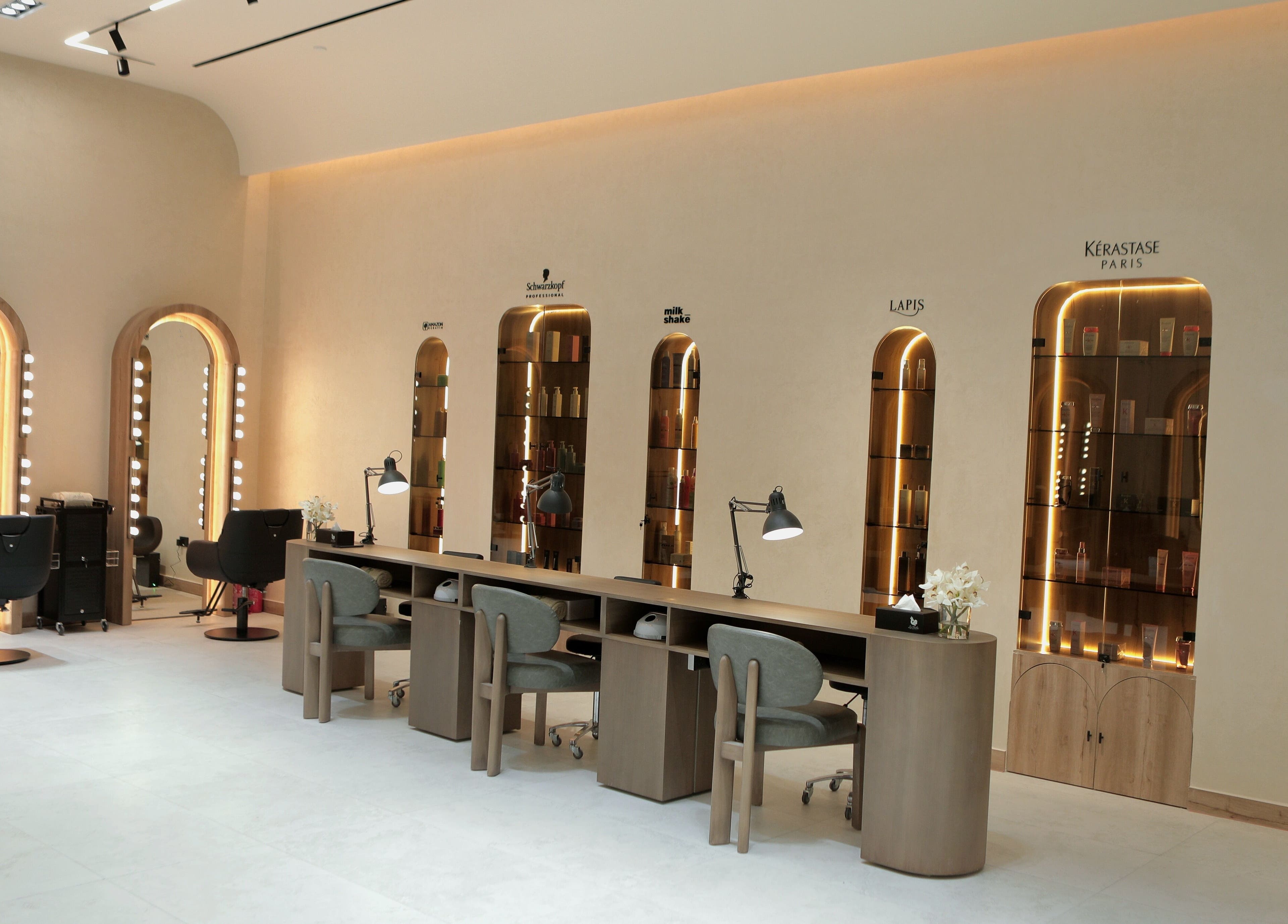 Stylish interior of La Biche Beauty Salon in Abu Dhabi, AE with modern mirrors and seating.