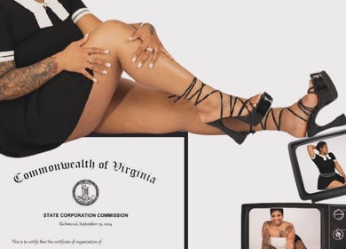 Stylish woman at Ambitious Beauty Bar, Virginia, US, showcasing tattooed leg with high heels.