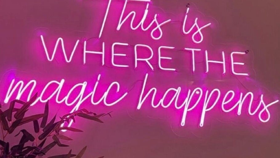 Pink neon sign reading 'This is where the magic happens' at Ambitious Beauty Bar, Virginia, Virginia, US.
