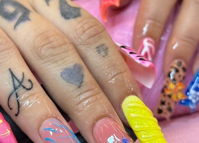 Vibrant nail art designs at Ambitious Beauty Bar, Virginia, Virginia, US showcasing creativity.