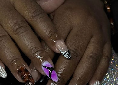 Intricate nail art design at Ambitious Beauty Bar, Virginia, Virginia, US, featuring vibrant and unique patterns.