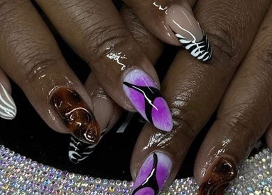 Stylish nail art with vibrant colors at Ambitious Beauty Bar, Virginia, Virginia, US.