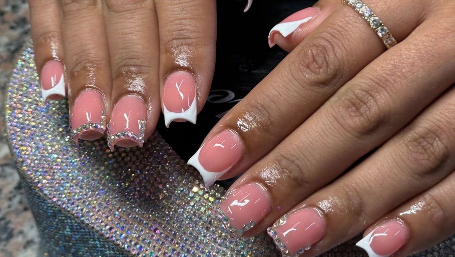 Elegant pink and white embellished nails at Ambitious Beauty Bar, Virginia, Virginia, US.