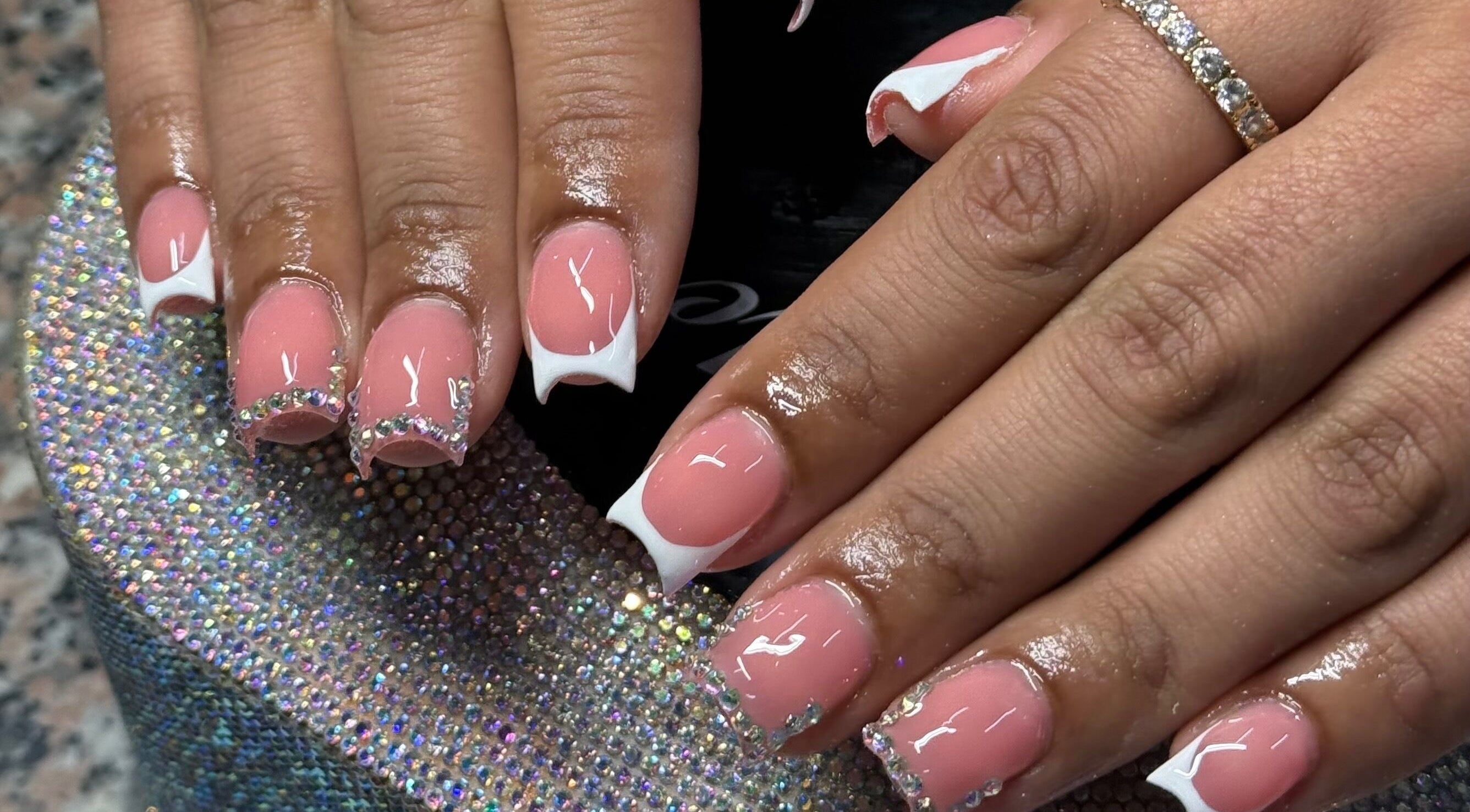 Elegant pink and white embellished nails at Ambitious Beauty Bar, Virginia, Virginia, US.