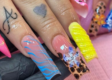 Colorful nail art at Ambitious Beauty Bar, Virginia, Virginia, US showcasing unique designs.