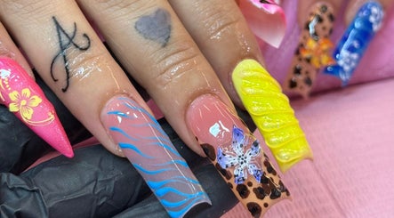 Colorful nail art at Ambitious Beauty Bar, Virginia, Virginia, US showcasing unique designs.