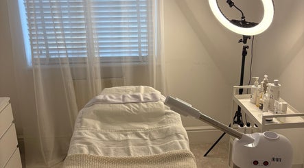 Peaceful treatment room at SknandSculpt in Ely, England, GB with massage table and skincare equipment.