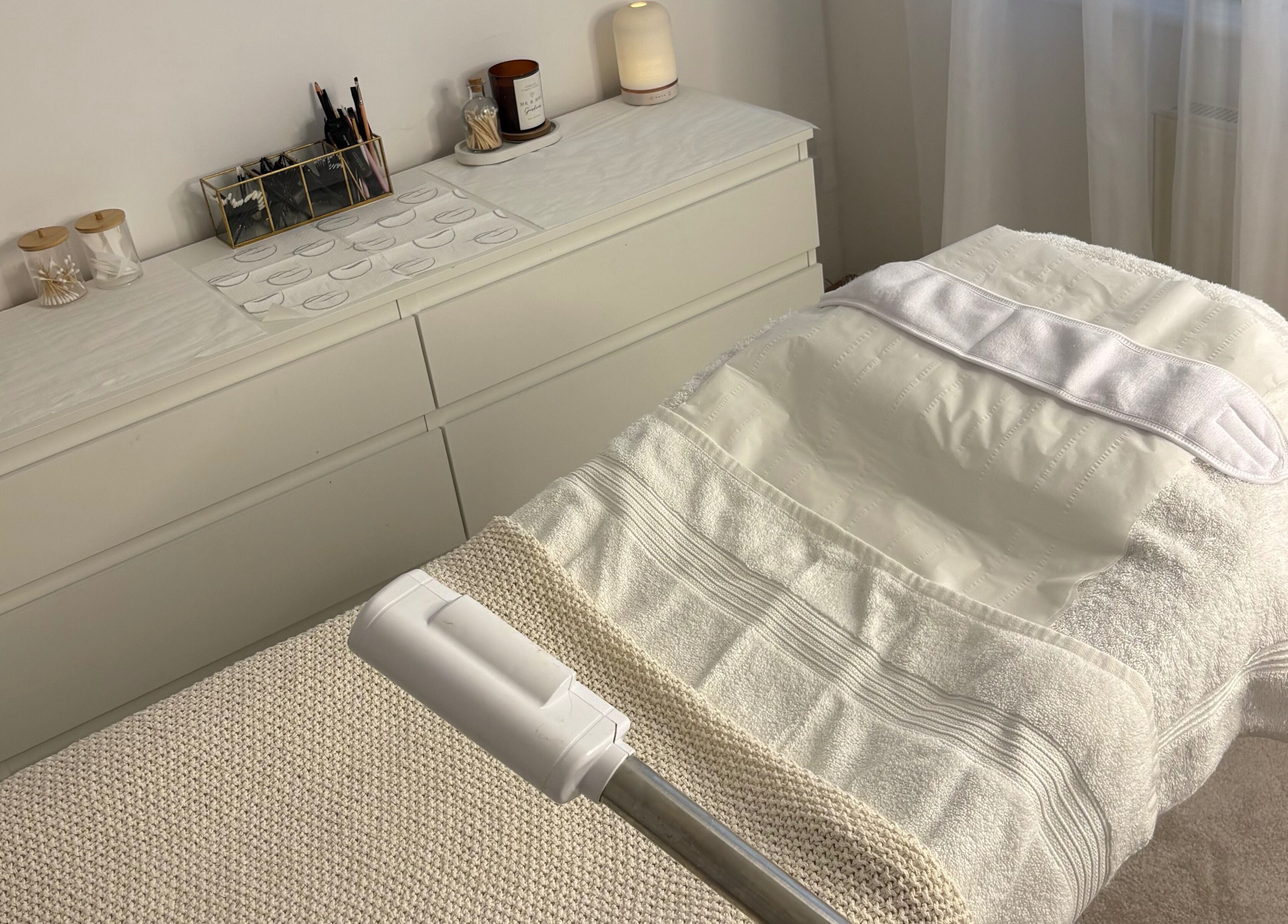 Relaxing treatment room at SknandSculpt in Ely, England, GB, featuring a cozy bed and soothing decor.