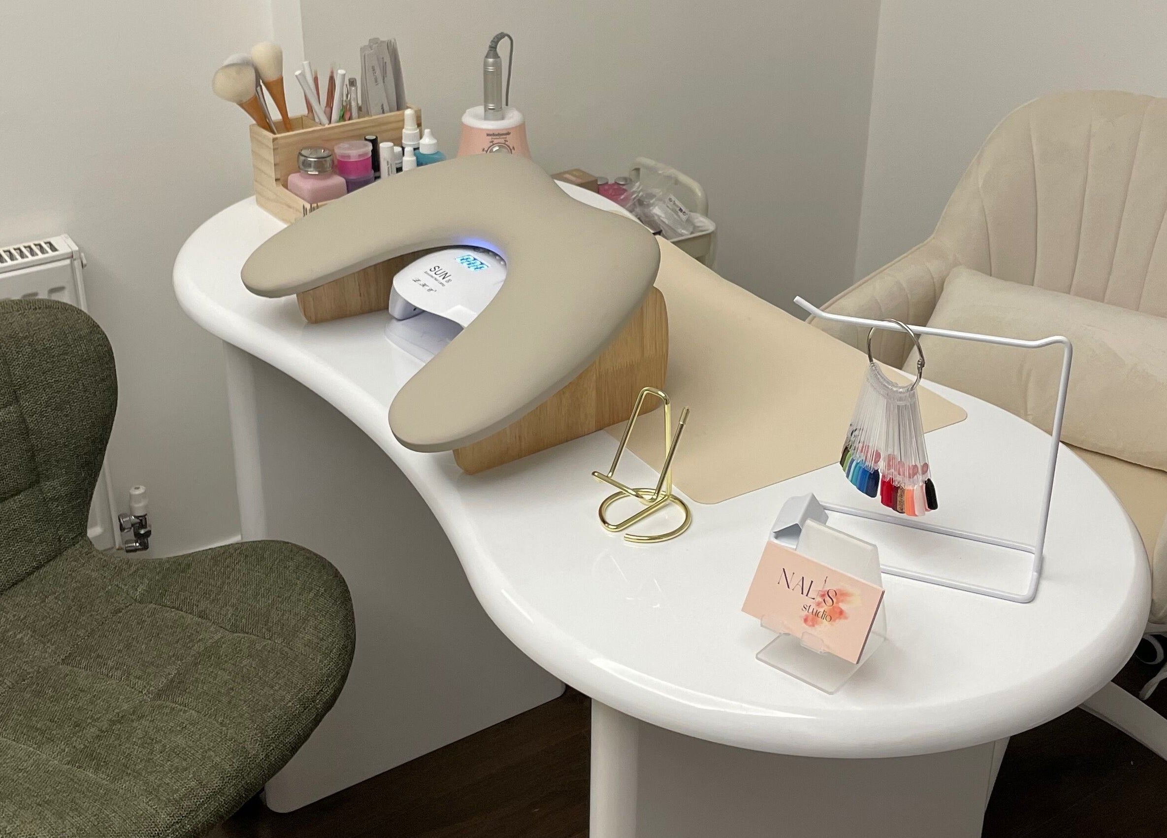 Chic nail station at Nalis Studio, Poole, England, GB featuring tools and a comfortable chair.