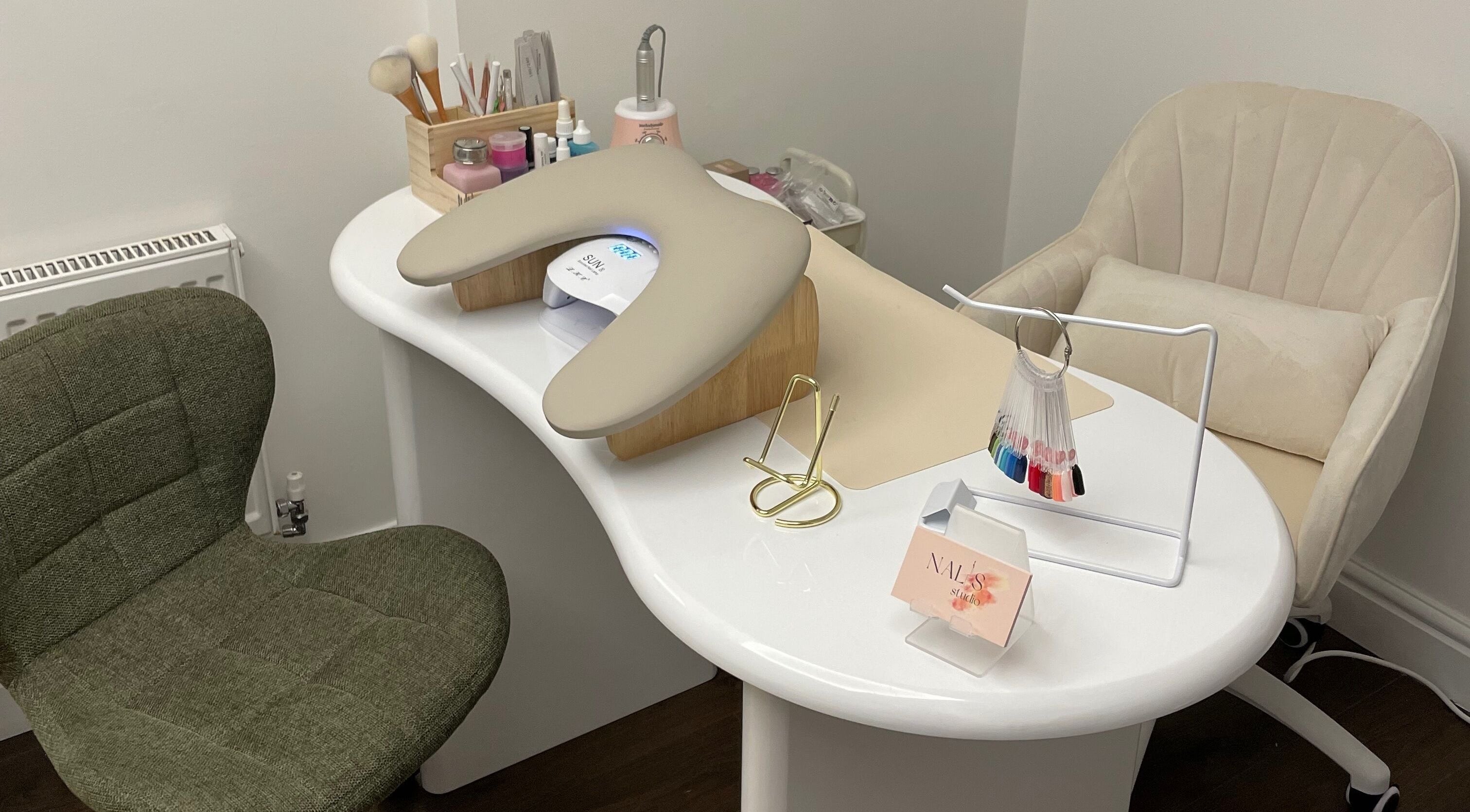 Chic nail station at Nalis Studio, Poole, England, GB featuring tools and a comfortable chair.