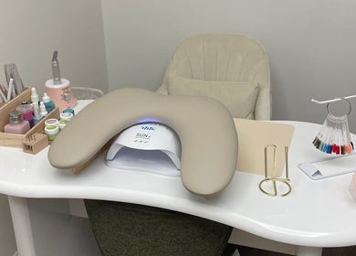 Elegant nail care station at Nalis Studio, Poole, England, GB, featuring nail polish and tools.