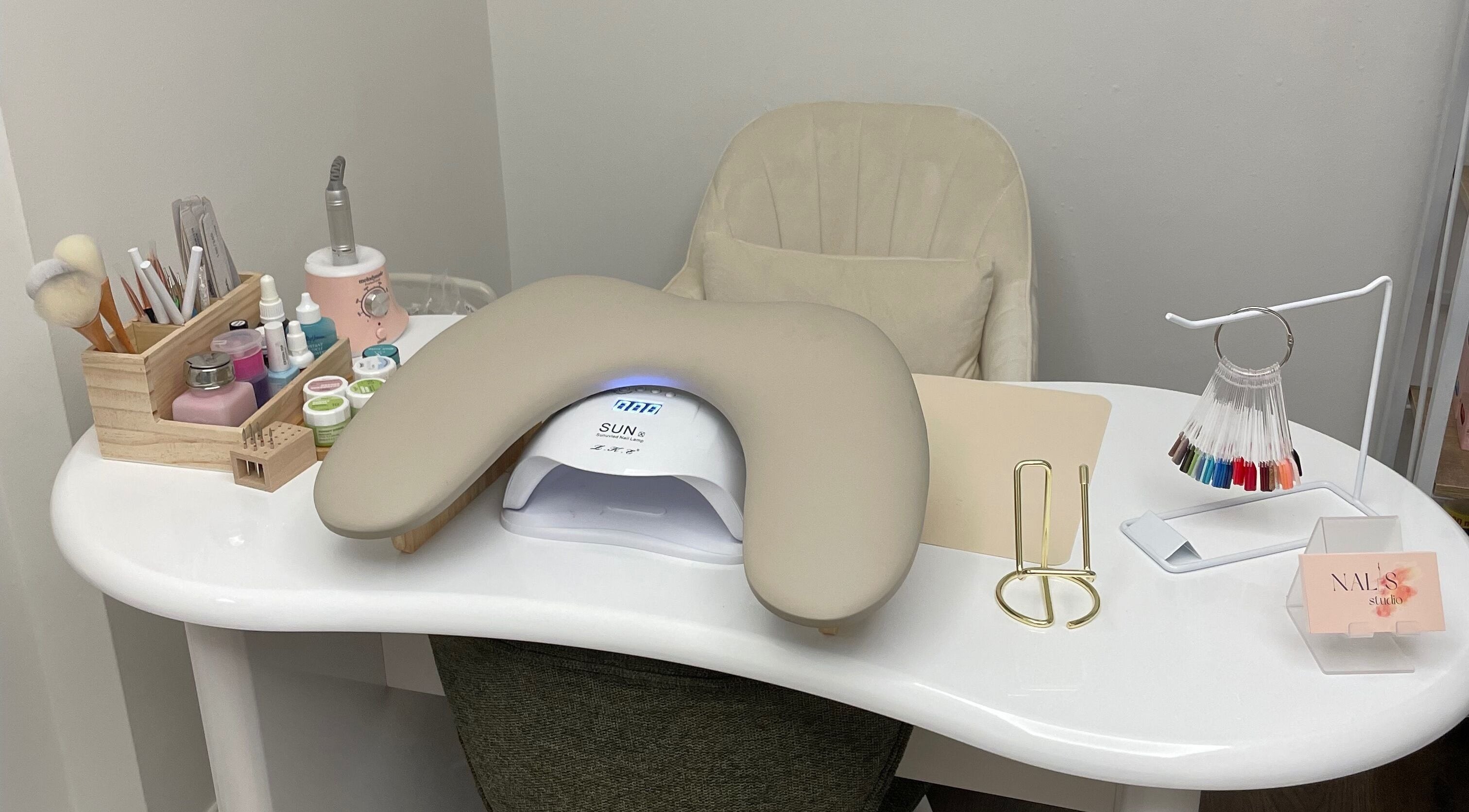 Elegant nail care station at Nalis Studio, Poole, England, GB, featuring nail polish and tools.