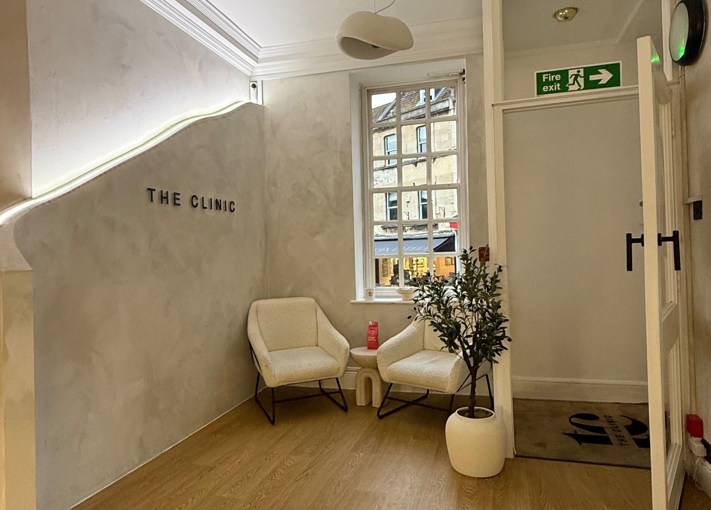 Inviting seating area at New Vision Aesthetics, Bath, England, GB with elegant decor and natural light.