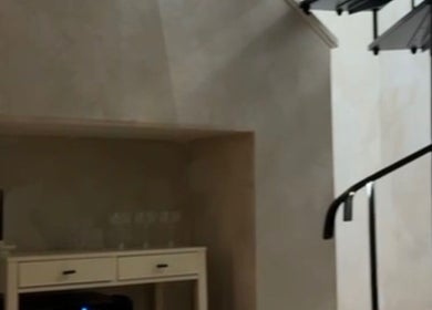 Modern staircase at New Vision Aesthetics, Bath, England, GB, enhancing the venue's sleek design.