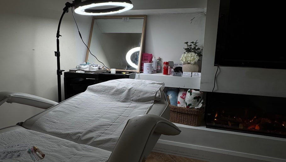 Kellsbeauty treatment room in County Kildare, IE, featuring a spa bed, mirror, and ambient lighting.