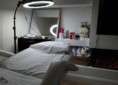 Kellsbeauty treatment room in County Kildare, IE, featuring a spa bed, mirror, and ambient lighting.
