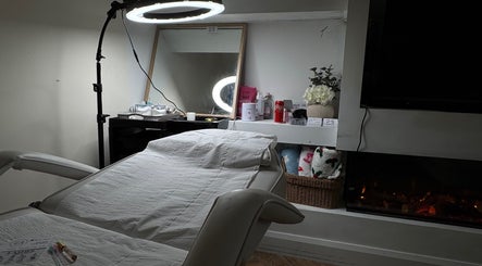 Kellsbeauty treatment room in County Kildare, IE, featuring a spa bed, mirror, and ambient lighting.
