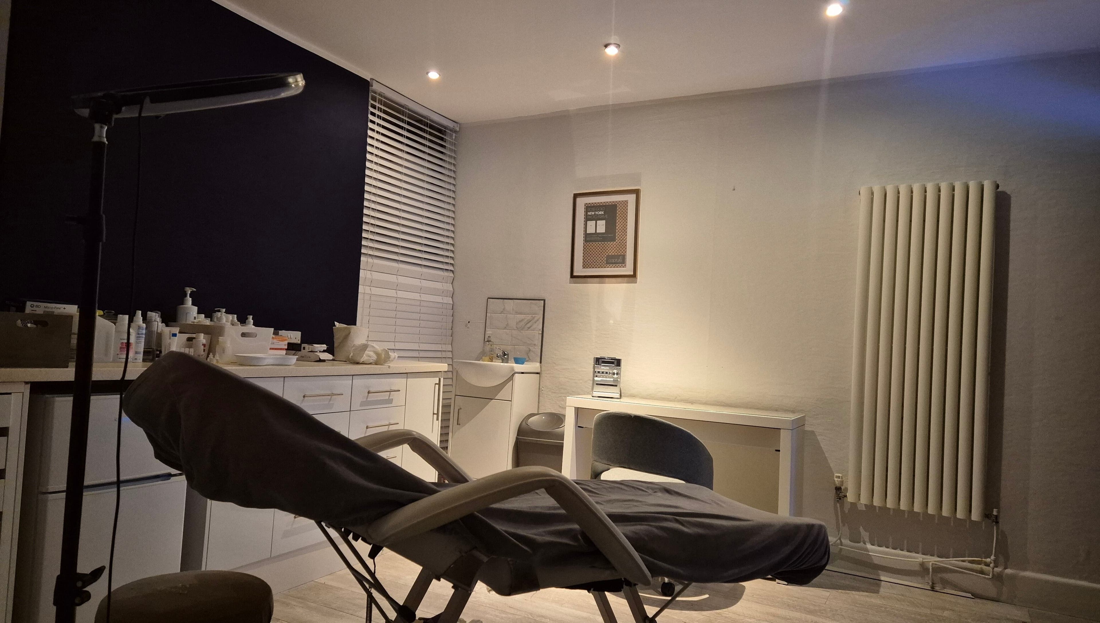 Peaceful treatment room at NatieeBeauty in Blackpool, England, GB with a comfortable chair and modern decor.