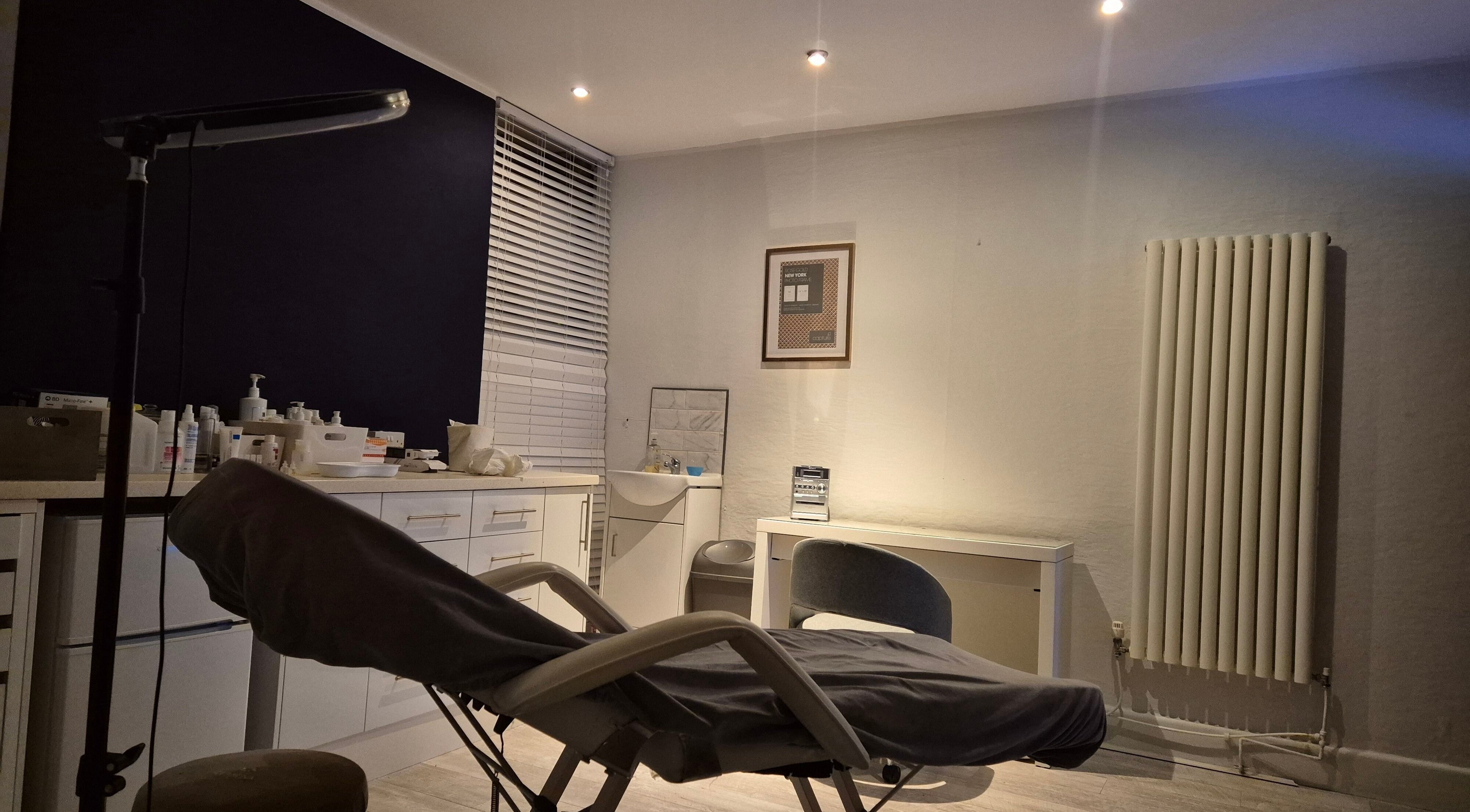 Peaceful treatment room at NatieeBeauty in Blackpool, England, GB with a comfortable chair and modern decor.