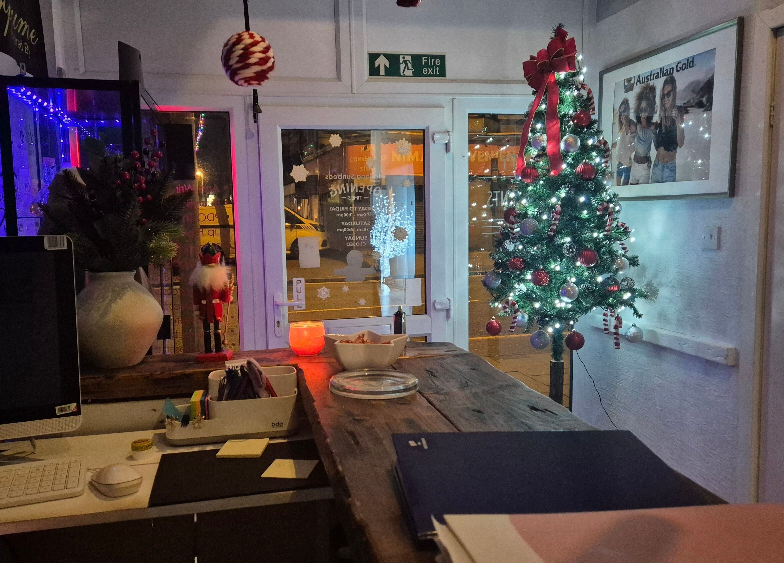 Decorated Christmas tree at NatieeBeauty's reception in Blackpool, England, GB, creating a festive atmosphere.