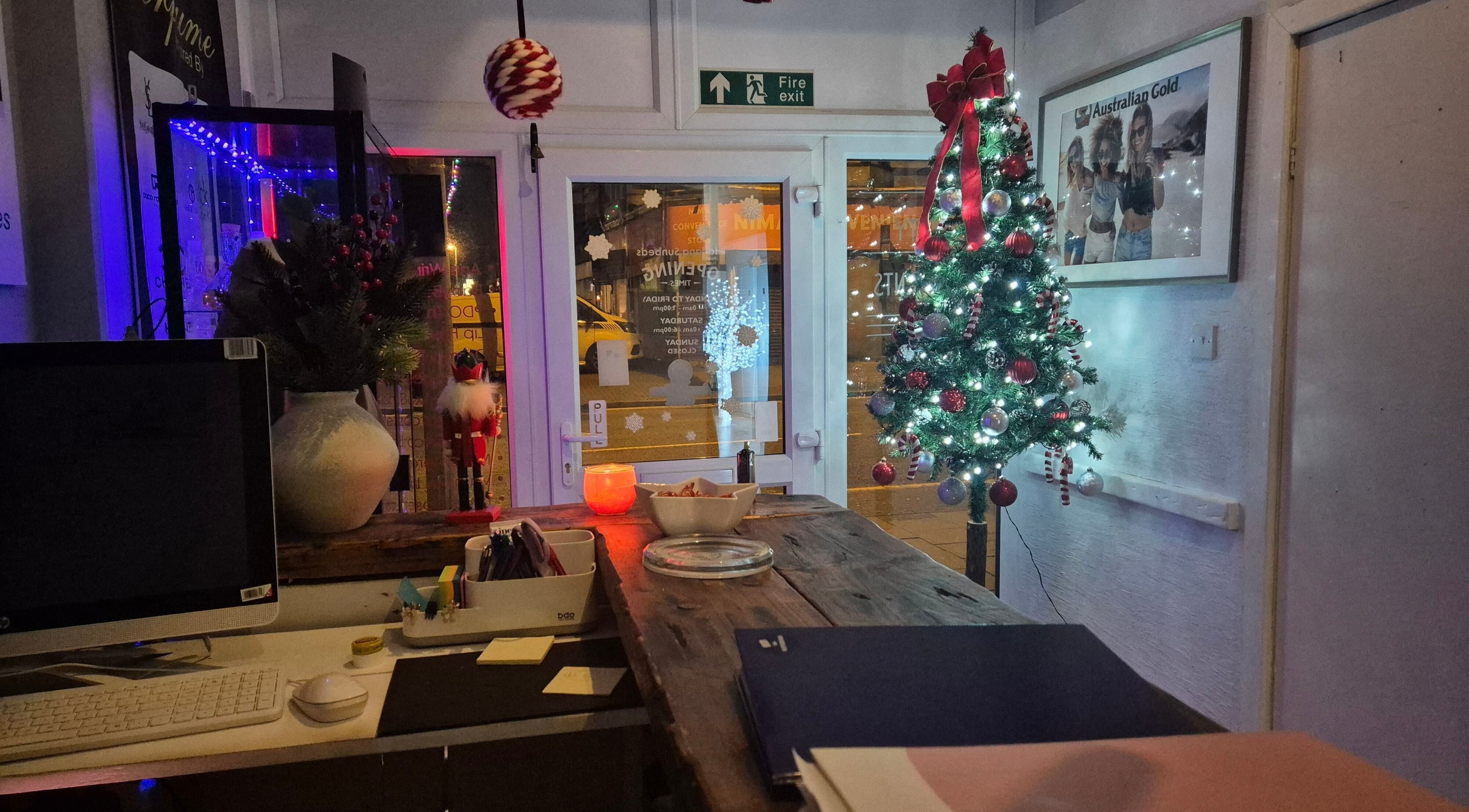 Decorated Christmas tree at NatieeBeauty's reception in Blackpool, England, GB, creating a festive atmosphere.