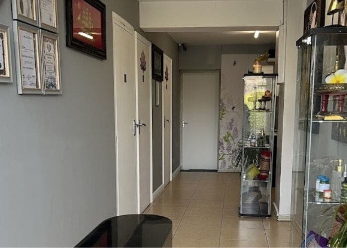 Entrance of Trust Thai Massage Therapy in Boston, Lincolnshire, featuring certificates and elegant decor.