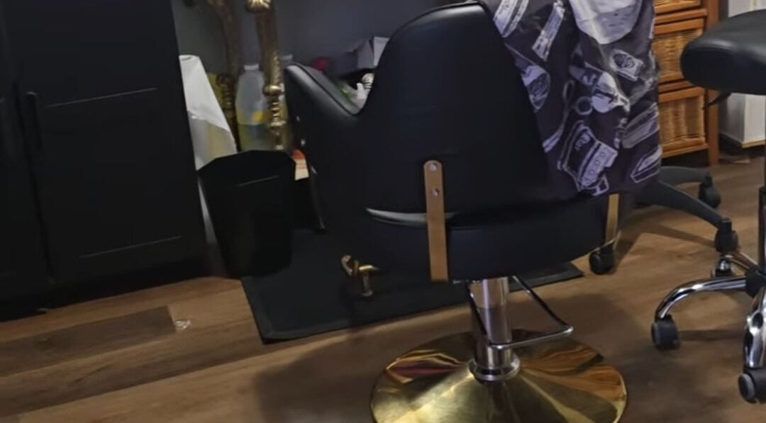 Elegant styling chair at Scissors & Serums, Whitby, Ontario, CA, highlighting comfort and style in a welcoming salon.