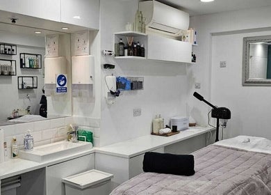 Serene spa treatment room at Innior Ltd, Teddington, England, GB, featuring a modern decor and tranquil ambiance.