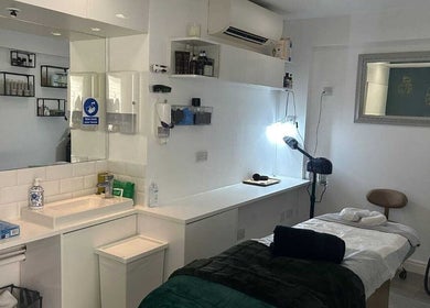 Modern treatment room at Innior Ltd in Teddington, England, GB with a cozy ambiance and elegant decor.