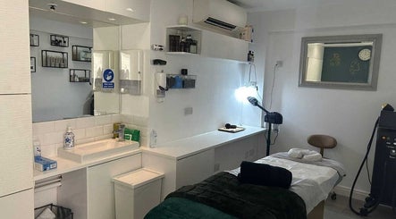 Modern treatment room at Innior Ltd in Teddington, England, GB with a cozy ambiance and elegant decor.