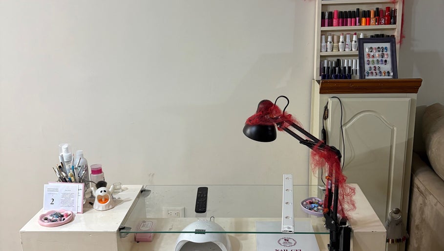 Manicure station at Annasofia Nails, Prados De Santa Rosa, Nuevo León, MX. Nail polish and tools are displayed.