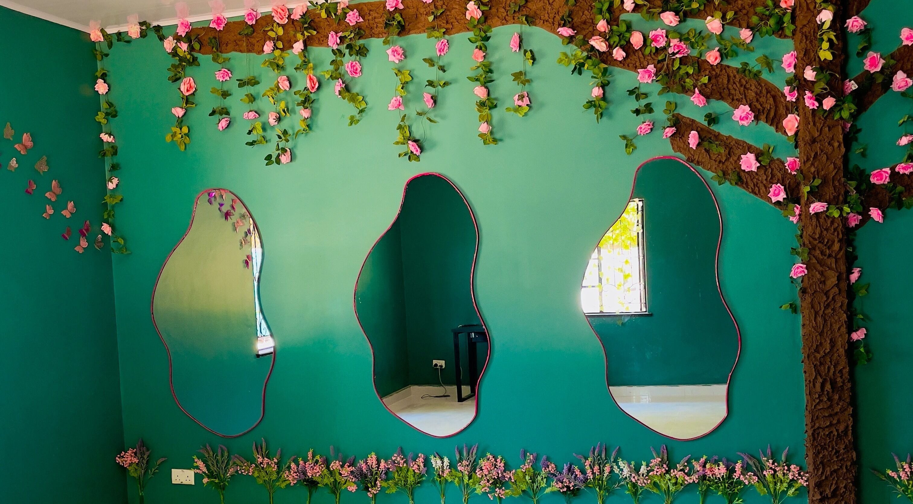 Vibrant floral mirror decor at Little Rootz - Kids Natural Hair Salon, Lusaka, Lusaka Province, ZM.