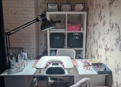 Elegant nail station at Muse K Nails in London, England, GB, featuring tools and polishes neatly organized.