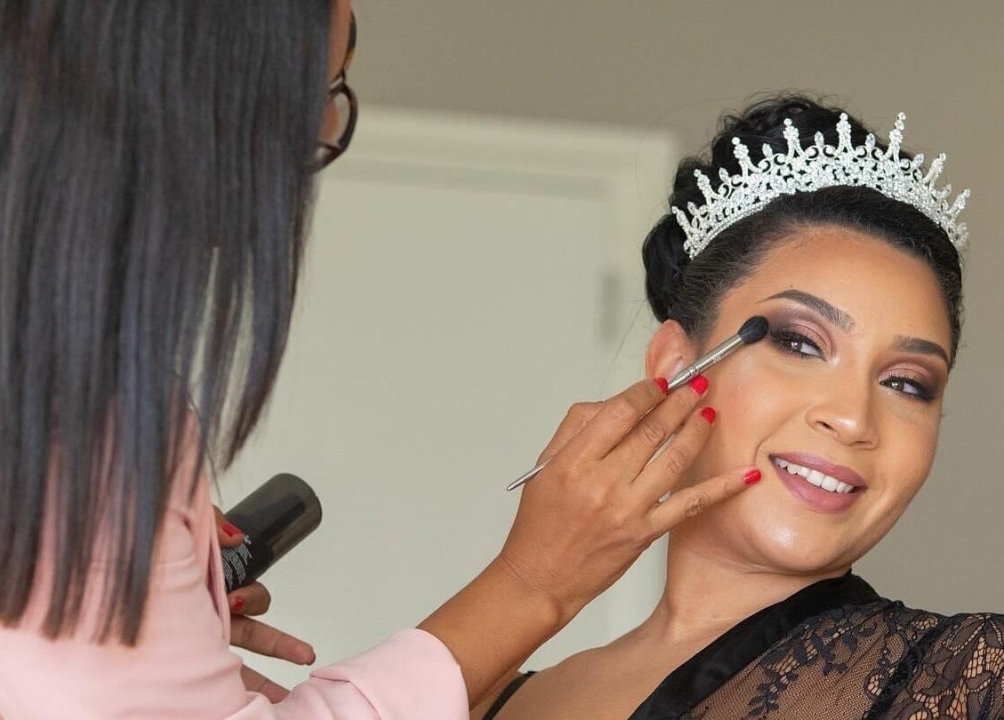 Makeup artist at Makeupbyjoselin in Kralendijk, Bonaire, BQ enhances client's look with a tiara and makeup.