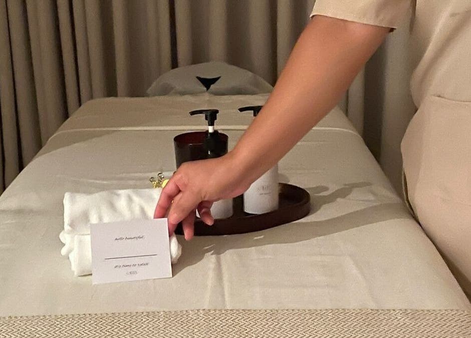 Massage table setup at Oria Spa Home Service, Riyadh, Riyadh Province, SA, featuring towels and spa products.