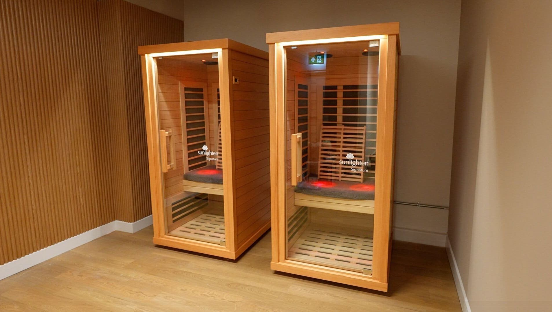 Two wooden infrared saunas at Revolt Cycling in London, England, GB offering a relaxing wellness experience.