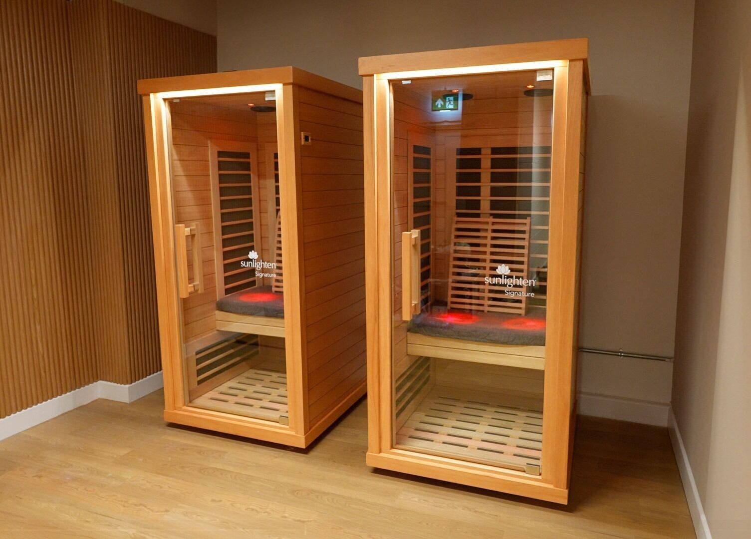 Two wooden infrared saunas at Revolt Cycling in London, England, GB offering a relaxing wellness experience.
