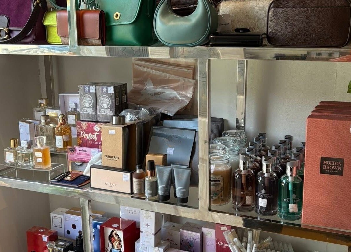 LuxuryCosmetics display with perfumes, skincare, and bags at South Woodham Ferrers, England, GB.