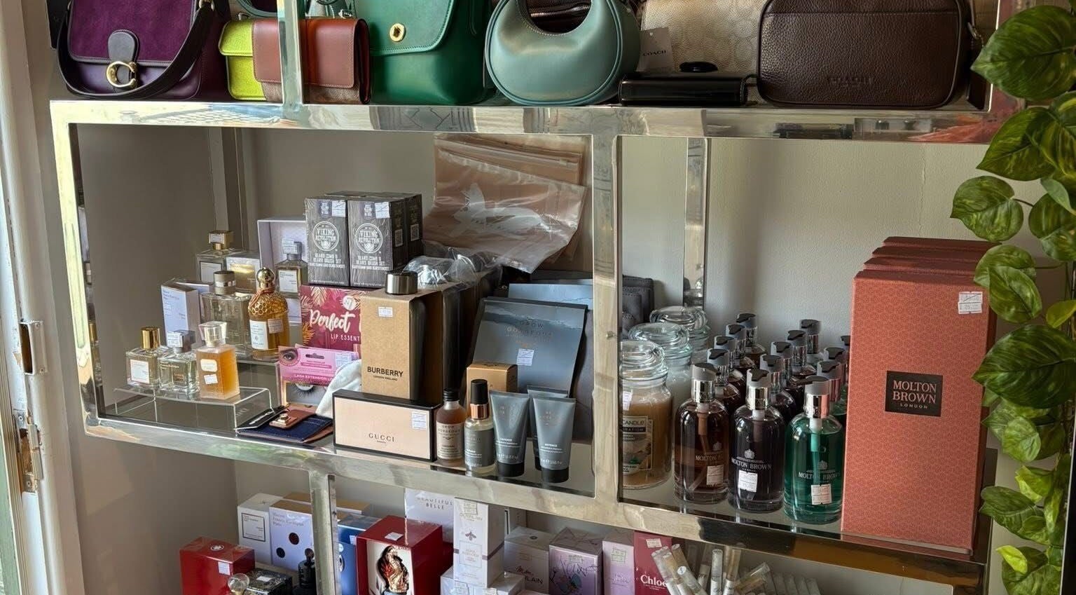 LuxuryCosmetics display with perfumes, skincare, and bags at South Woodham Ferrers, England, GB.