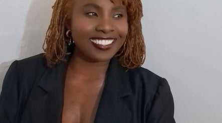 Warm smile from Loctician en route at Cape Town, Western Cape, ZA, showcasing professional locs style.